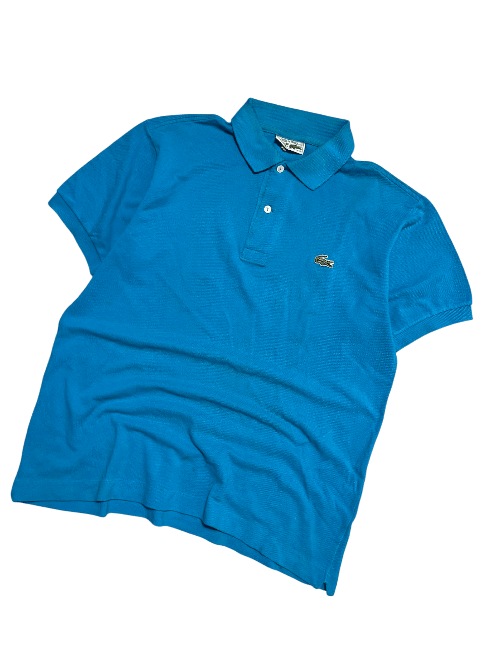 Kék vintage Lacoste rövid ujjú galléros póló hímzett logóval, streetwear stílus