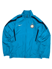 Kék vintage Nike sportdzseki Inter Milan logóval, cipzáros, streetwear stílusban.